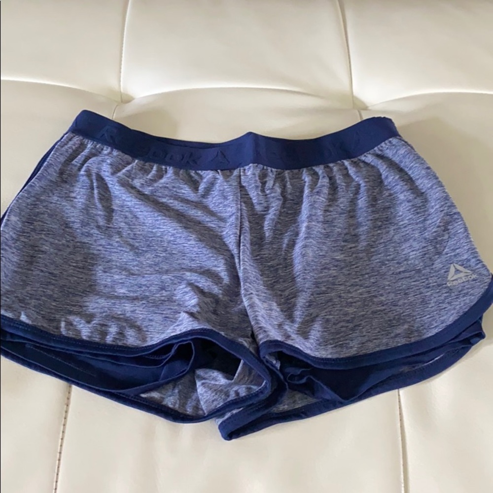 Blue Reebok athletic running shorts